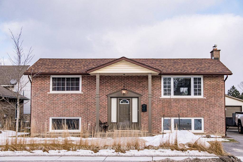 Nestled in the heart of Jordan, this impeccably maintained raised bungalow sits on a stunning 1 3 acre private lot, backing onto a tree farm.