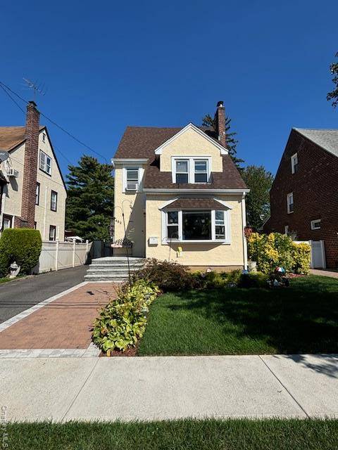 Welcome To This Beautifully Updated Tudor Style Stucco Home In The Heart Of Mineola !