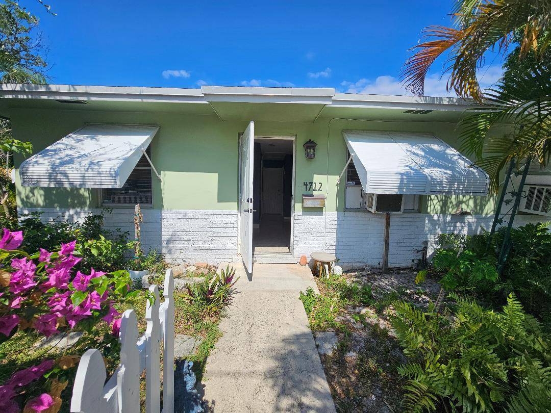 CORNER DUPLEX WITH CARPORT ON ONE SIDE AND OFF STREET PARKING FOR THE OTHER UNIT.