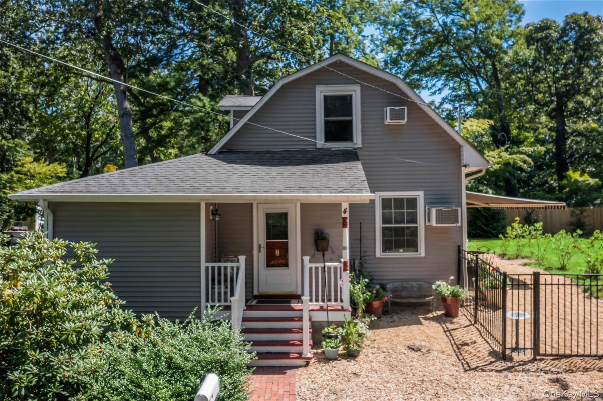 Welcome to this Charming Cottage Craftsman Style home located in Old Stony Brook.