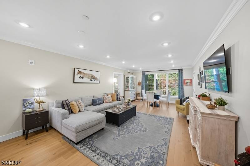 Experience easy living in this beautifully maintained second floor residence within the gated Fox Hill community.