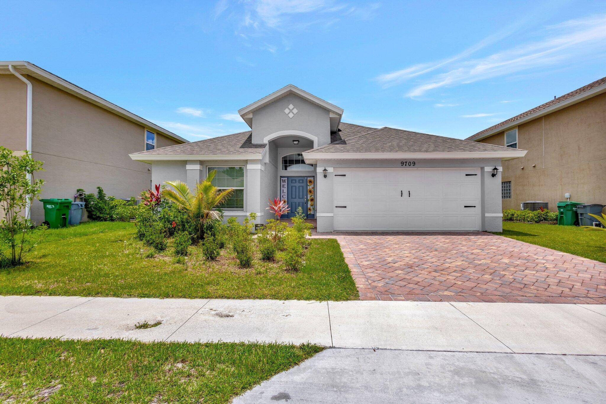 This charming 3 bedroom, 2 bath home offers a spacious open floor plan with vaulted ceilings and an inviting covered lanai.