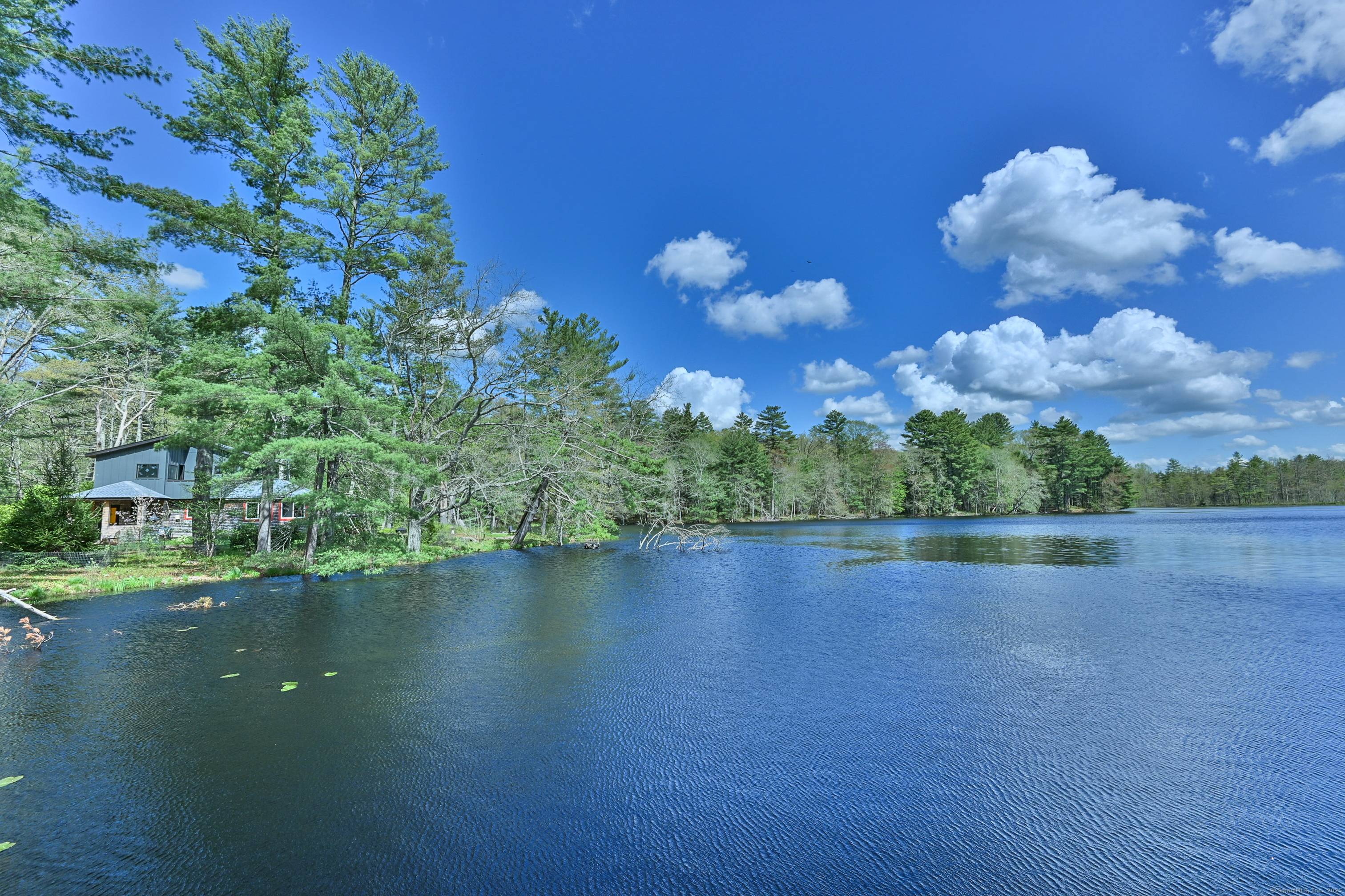A truly rare and magical offering live immersed in nature on a private, 13 acre brook fed private pond, complete with cascading waterfall, serene wetlands, forested trails and wildflower meadows.