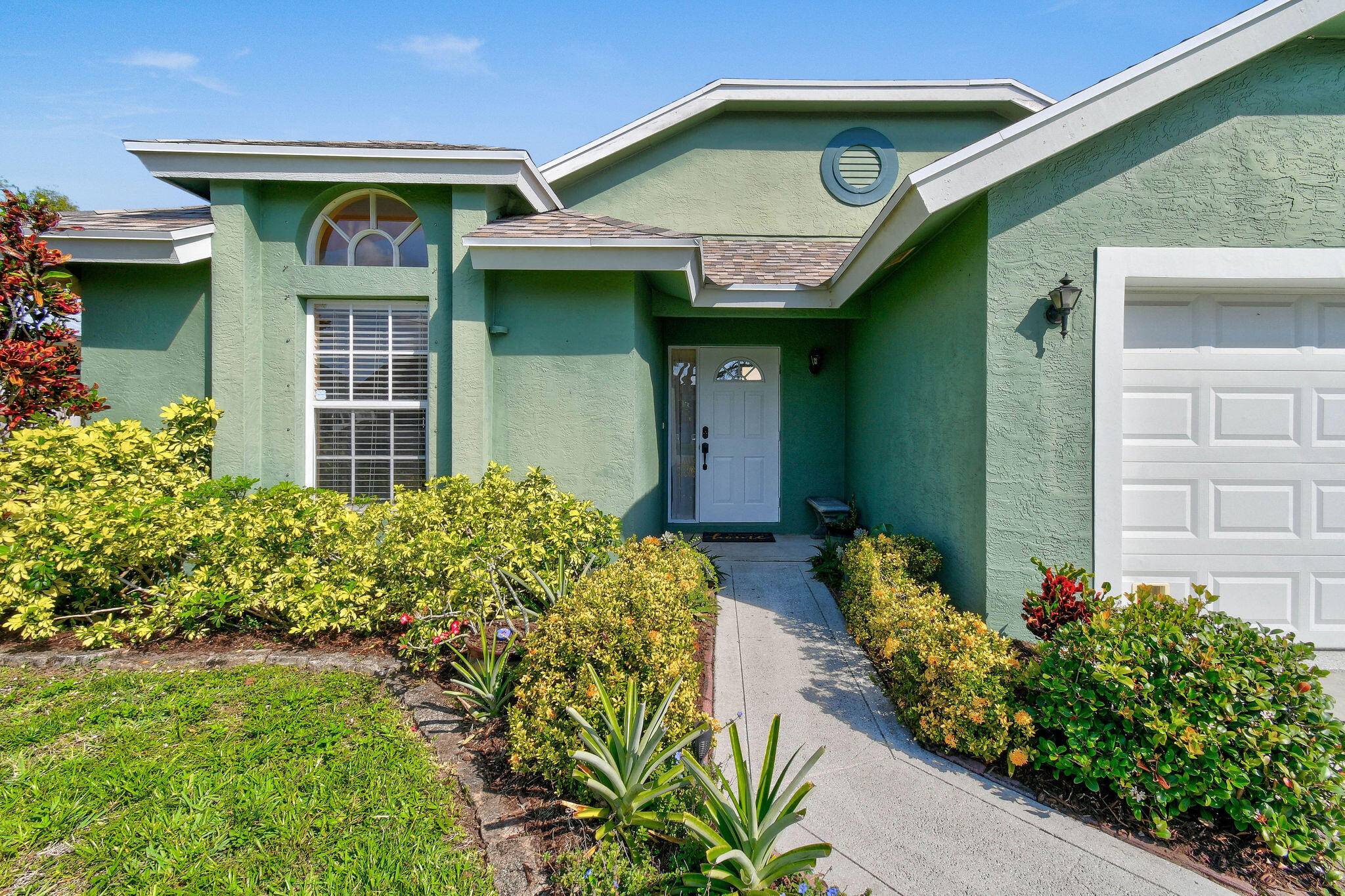 NO HOA Delightful 3 bedroom, 2 bathroom CBS home in highly desired North Palm Beach Heights.