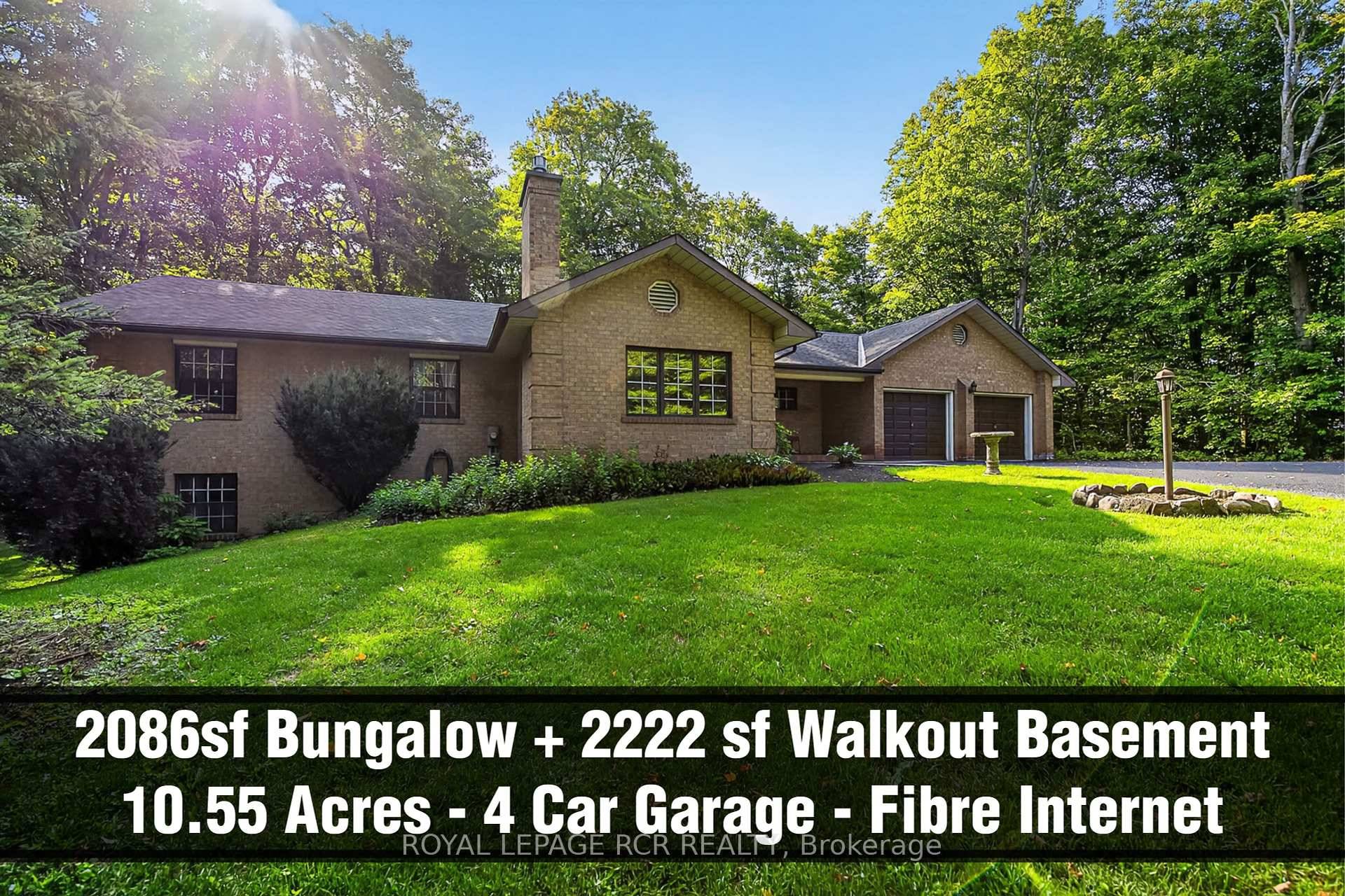 10. 55 Acres Fibre Optic Internet 3 1 bedroom Bungalow with side walk out finished basement with in law suite potential, 4 car garage and long private driveway.