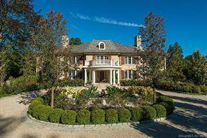 Extraordinary Belle Haven peninsula stone manor style 7 bedroom home completely rebuilt and expanded in 2012.