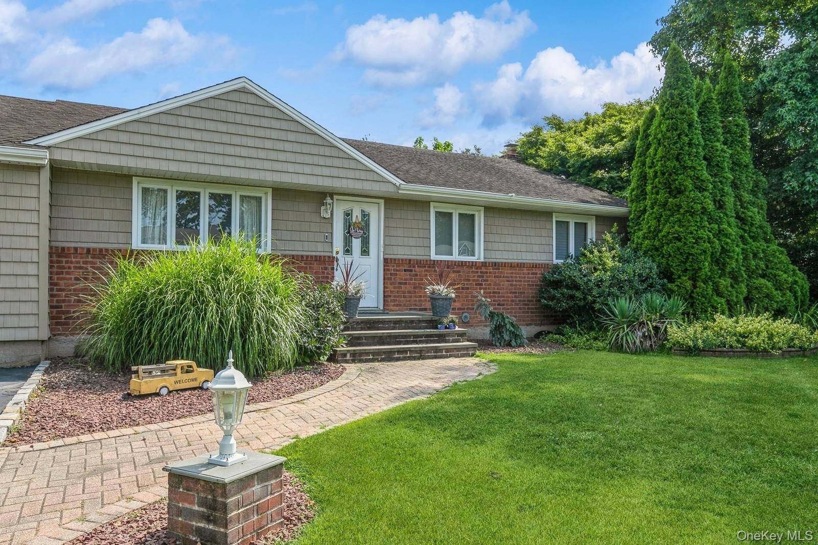 Welcome to this stunning, fully updated ranch boasting 3 spacious bedrooms and 3 full baths, perfectly set on nearly half an acre in the highly sought after Commack School District.