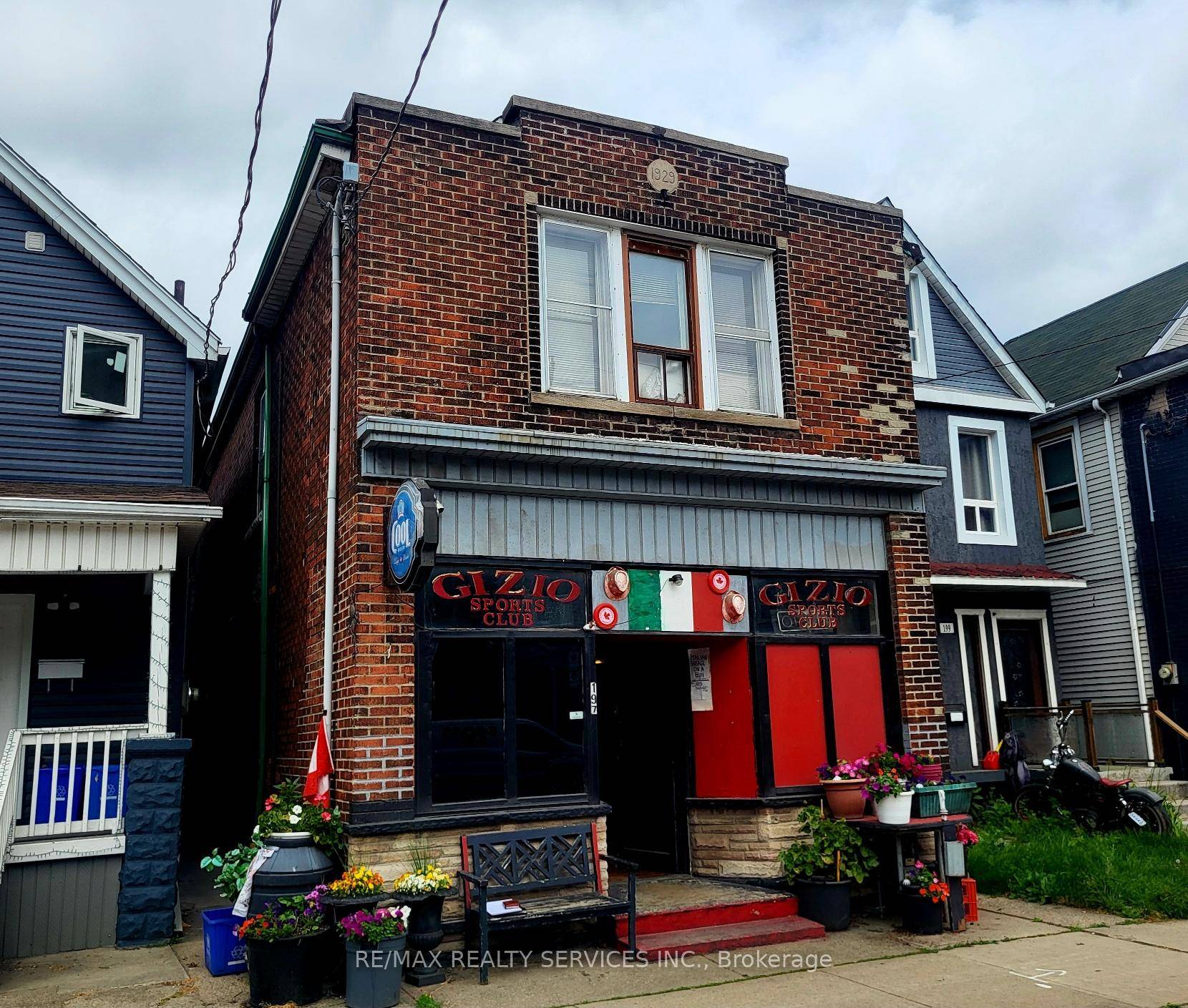 Amazing opportunity ! Fully detached all brick building operating as a sports club bar with a two bedroom rental apartment on the upper level.