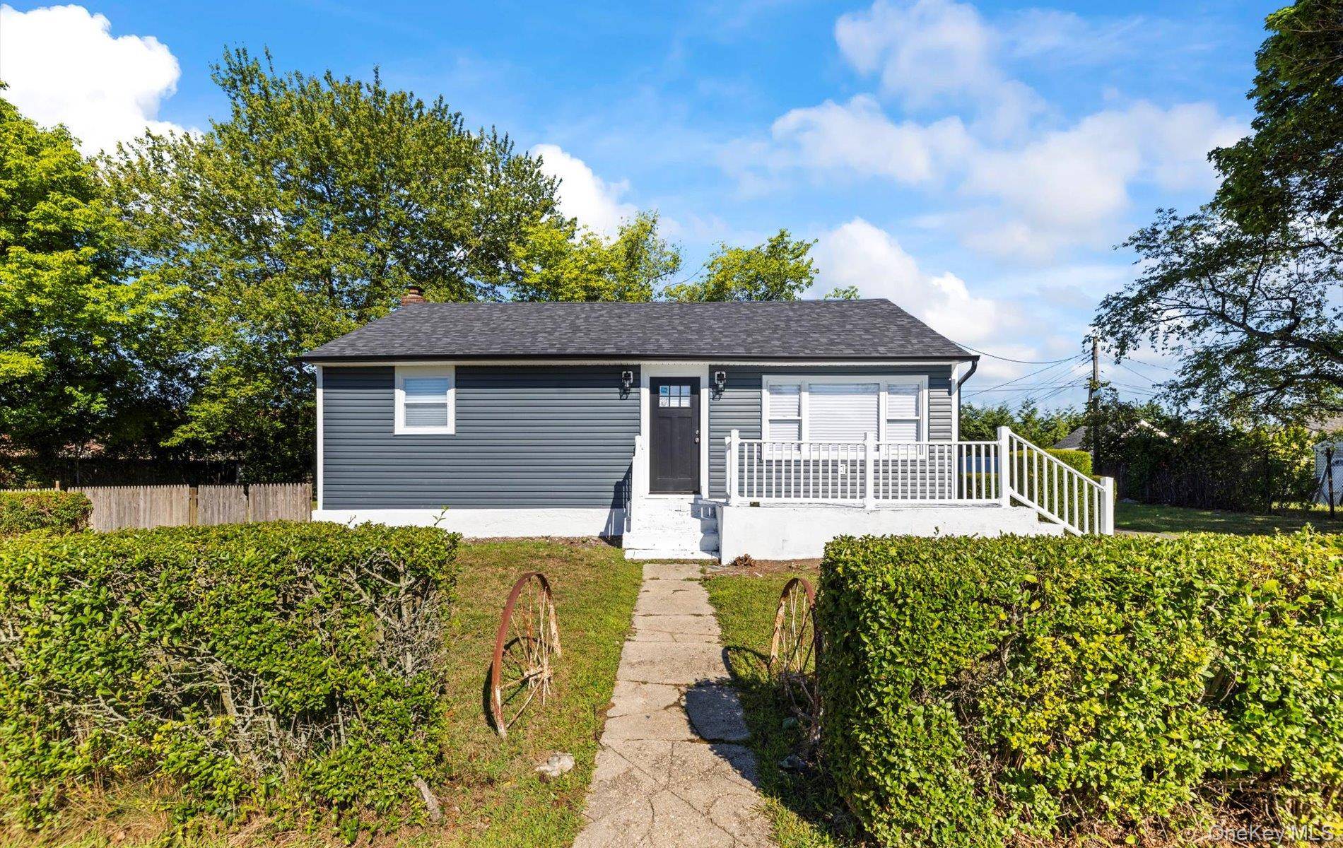 Welcome to 1 Atna Dr in Amityville, where modern comfort meets classic charm.