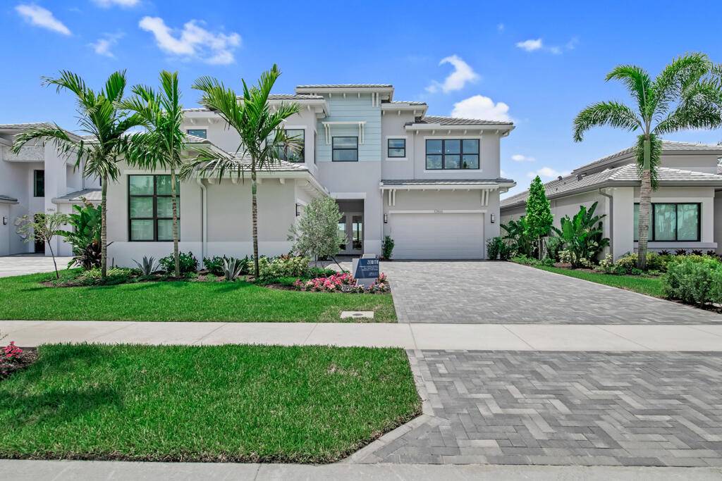 Welcome to your dream estate at 12862 Crane Crossing, nestled within the prestigious Avenir community of Palm Beach Gardens.