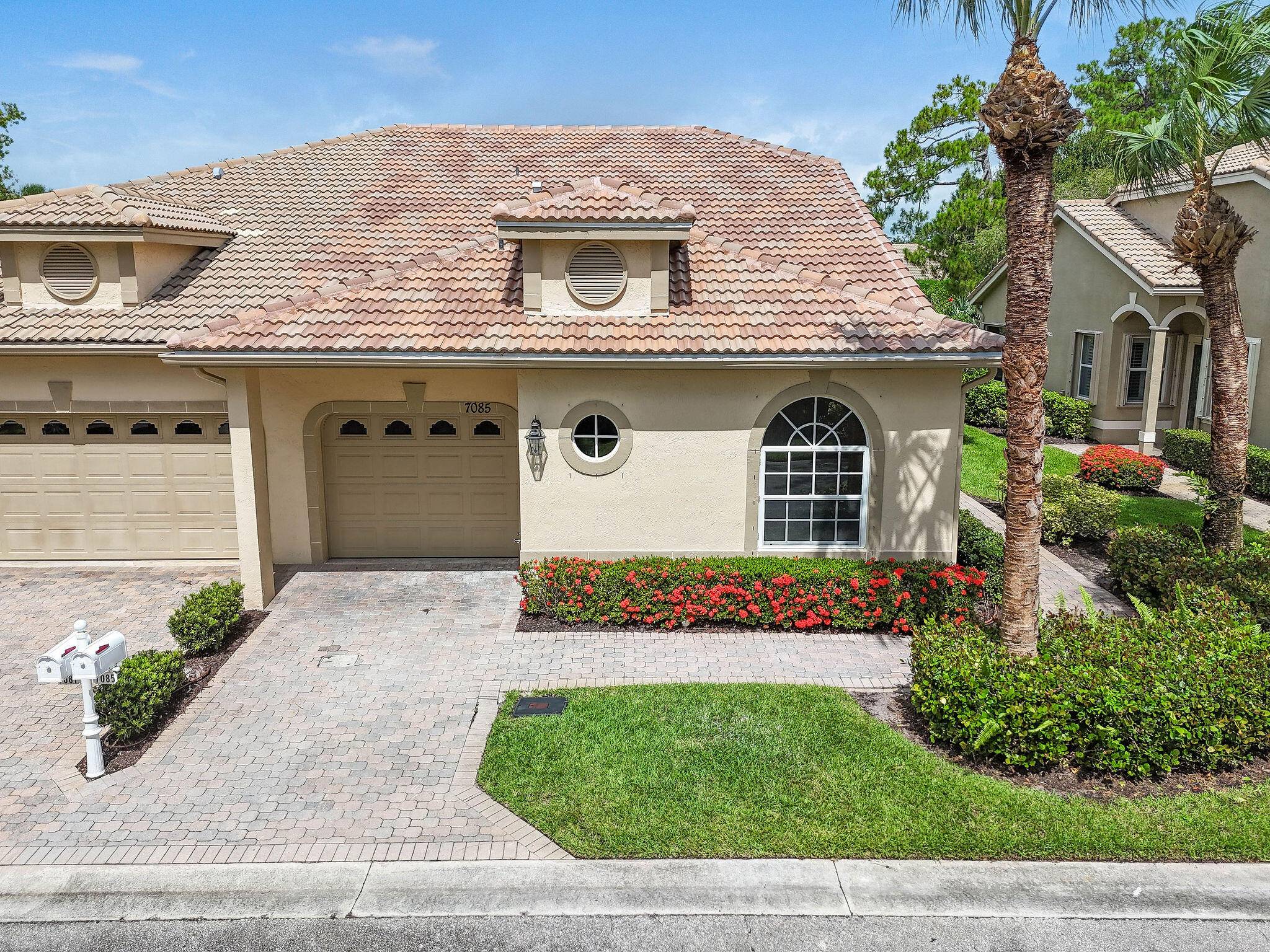 BRAND NEW ROOF on this beautifully updated 2 bedroom, 2 bath, 1 car garage villa in the sought after PGA Village.