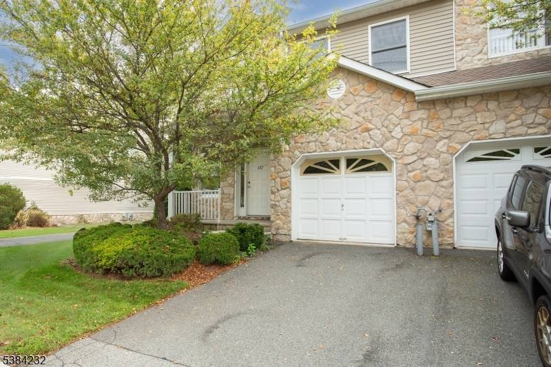 Welcome to this sun filled end unit townhome in desirable Glenmont Commons !