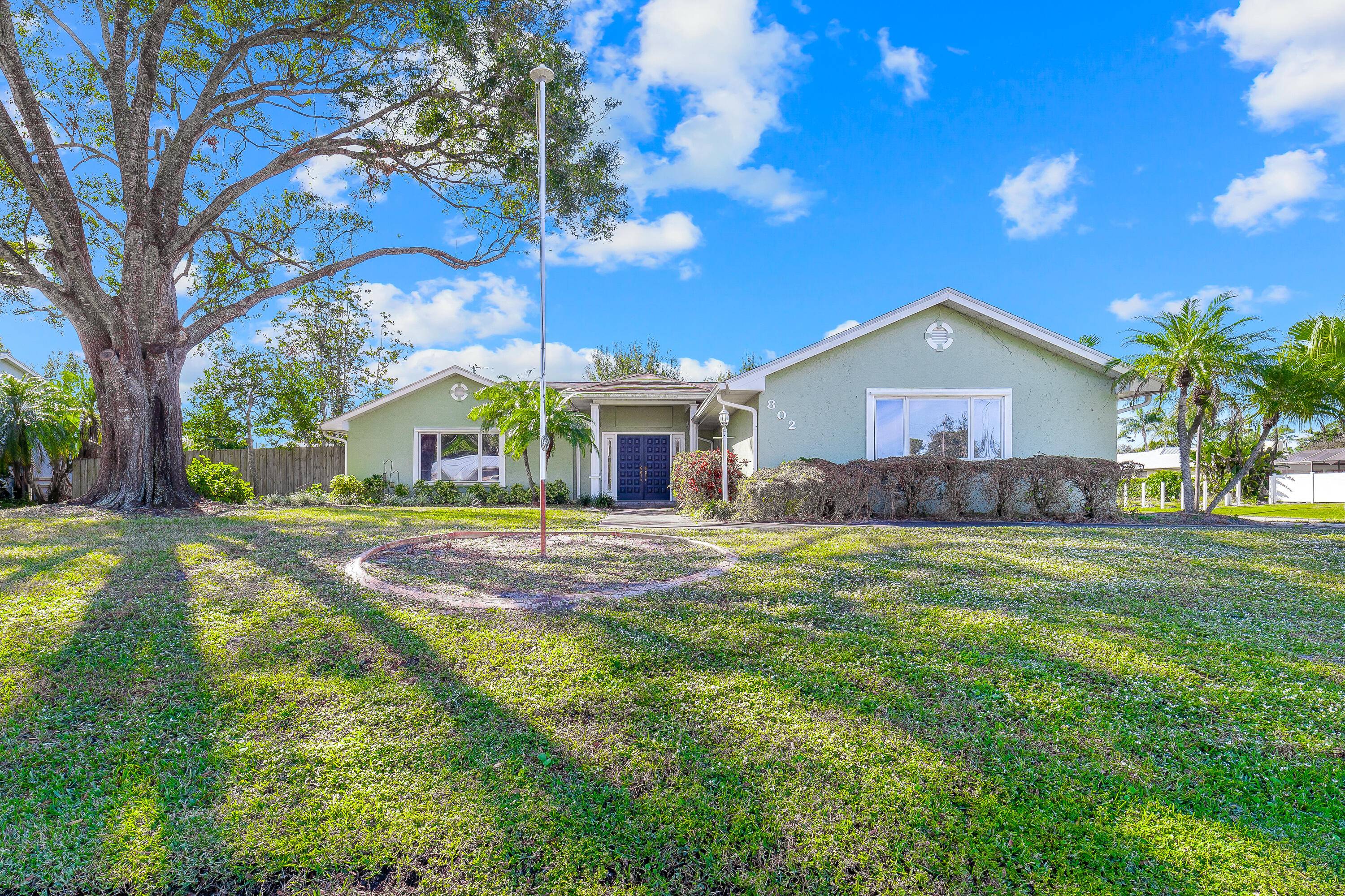 This beautifully maintained Port Saint Lucie custom built home is set on an oversized, well manicured corner lot.