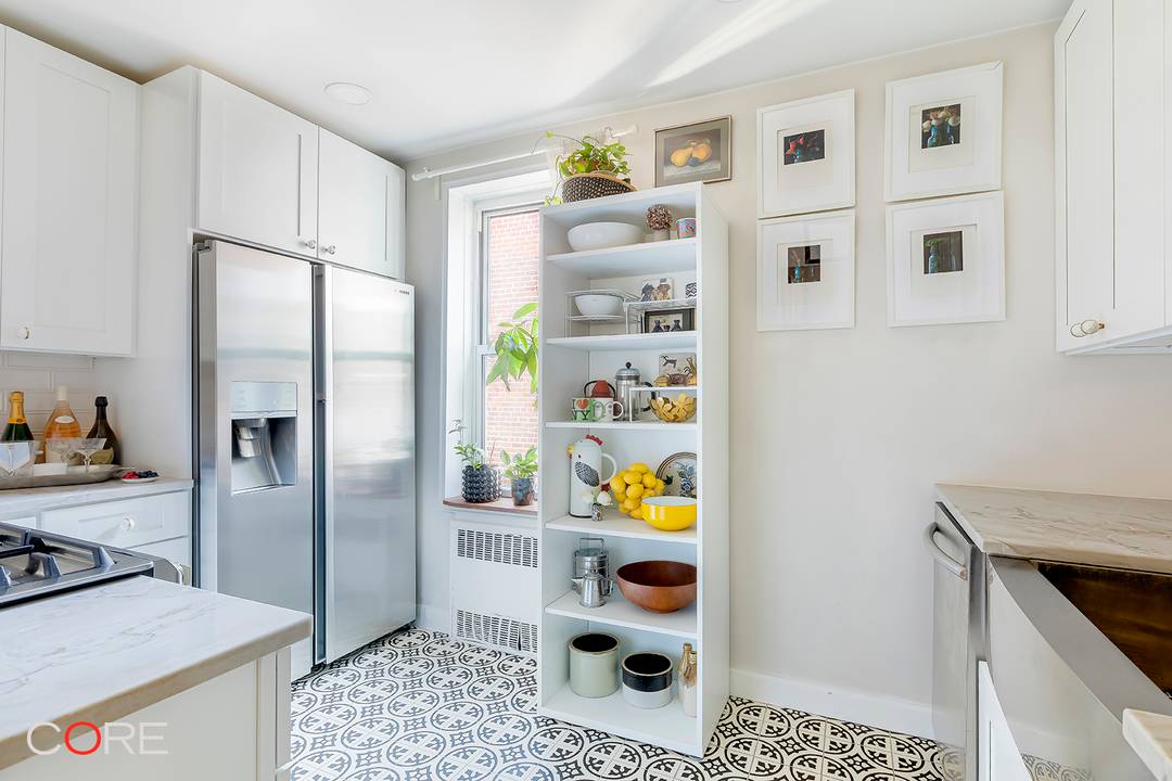 Quiet Luxury in a Fully Renovated Top Floor Corner Unit.