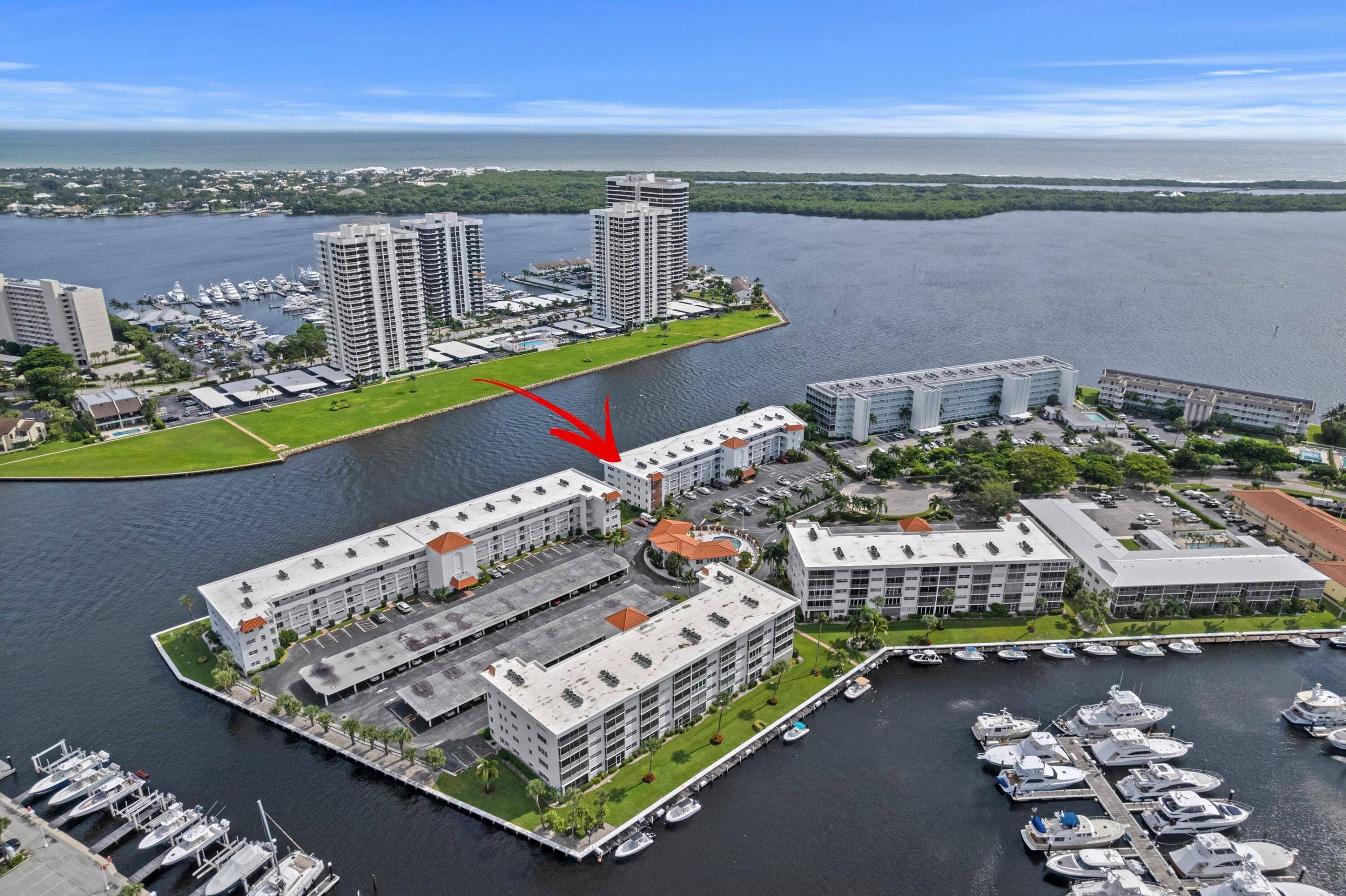 ABSOLUTELY GORGEOUS WATERFRONT CONDO PRESTIGIOUS 55 COMMUNITY PORTS O'CALL BREATHTAKING INTRACOASTAL VIEWS NEW 2025 ROOF Bright Open Floor Plan Hardwood Floors Crown Molding Stunning Eat In Kitchen Breakfast Bar Corian ...