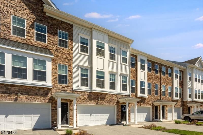 Experience luxury living in this stunning townhome, built in 2020, featuring 3 bedrooms and 3.