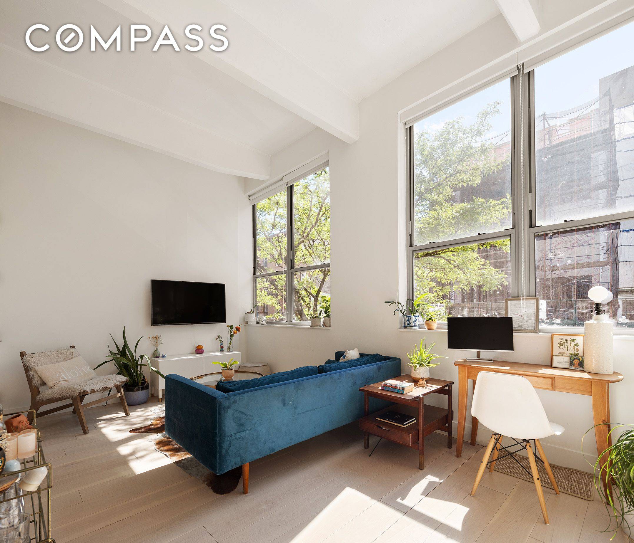 Welcome home to residence 2G at 338 Berry Street, a former factory converted to a full service, 60 unit loft condominium.