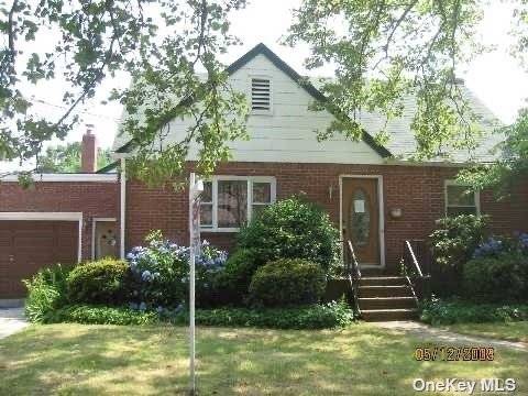 Well kept Cape Home with Full Dining Room Family Room.