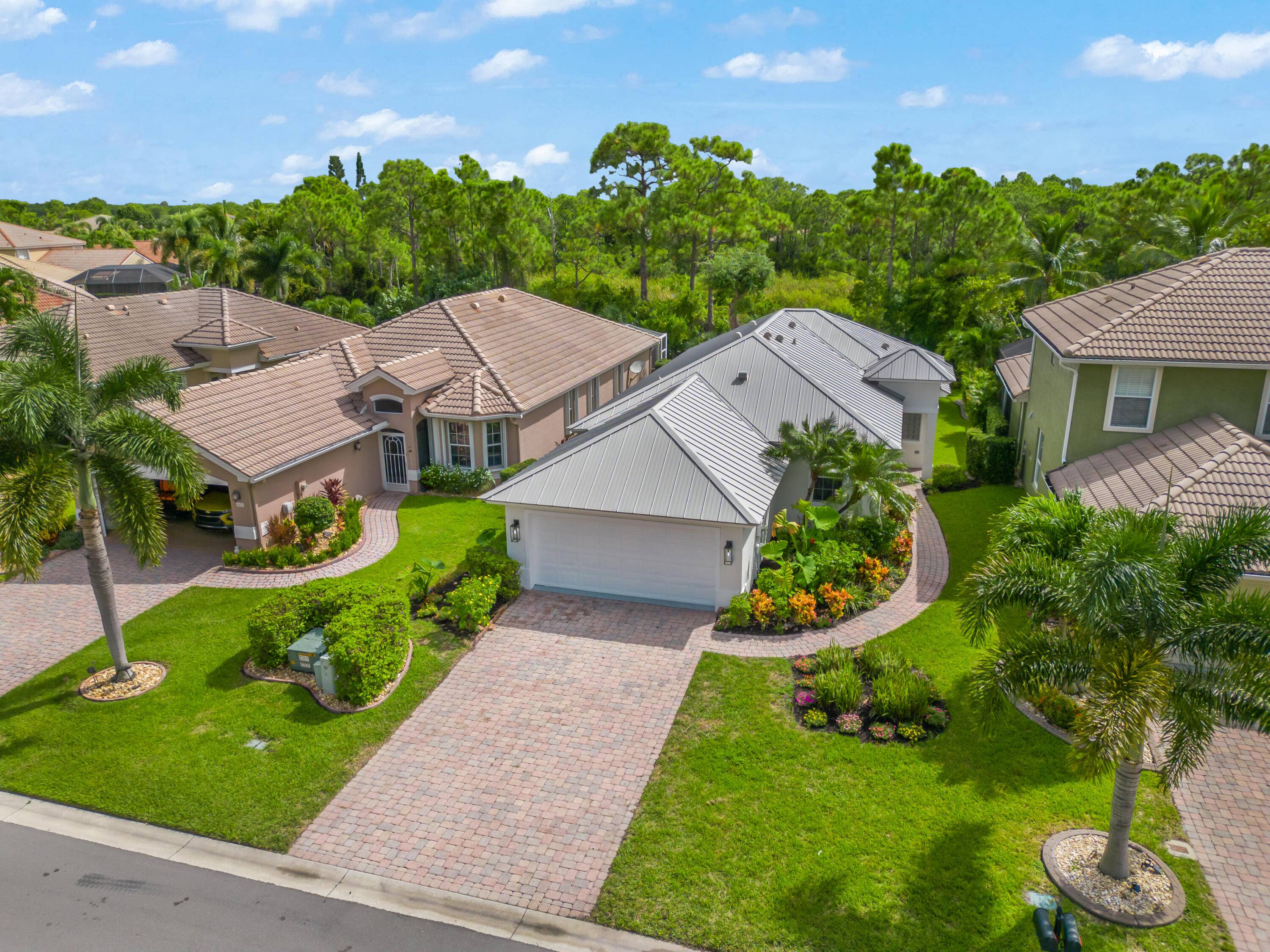 Welcome home to this beautifully renovated 3 2 2 in Jensen Beach Country Club !