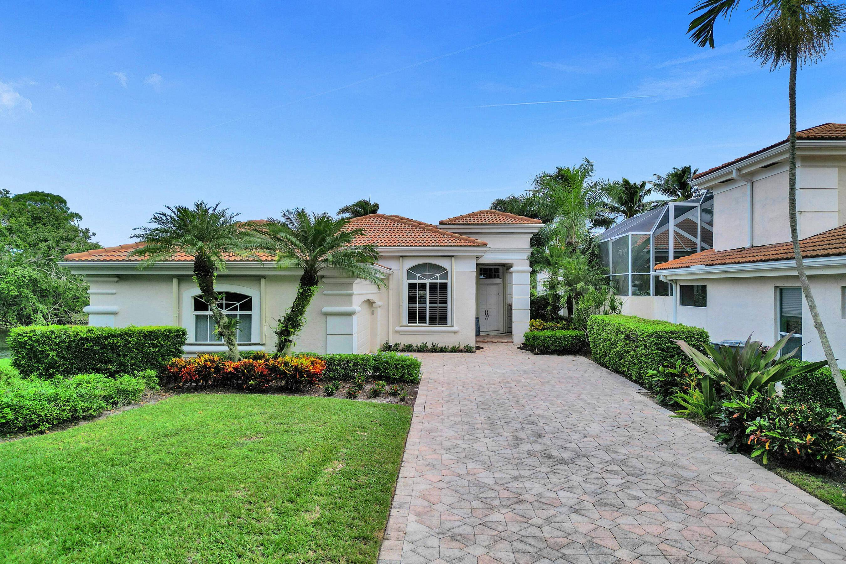 Discover resort style living in this 3 bedroom, 3 bath home in the highly sought after community of Ballenisles.