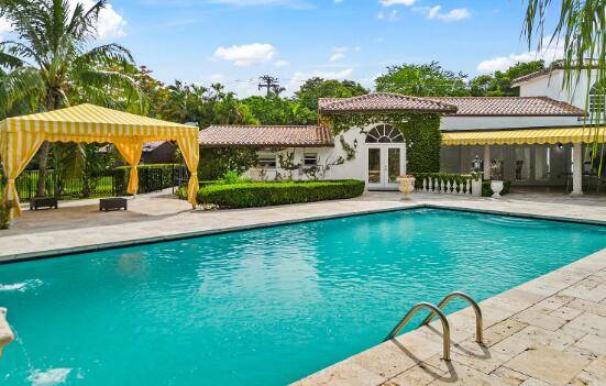 On the iconic, tree lined stretch of Old Cutler Rd, this private Pinecrest estate sits on 1.