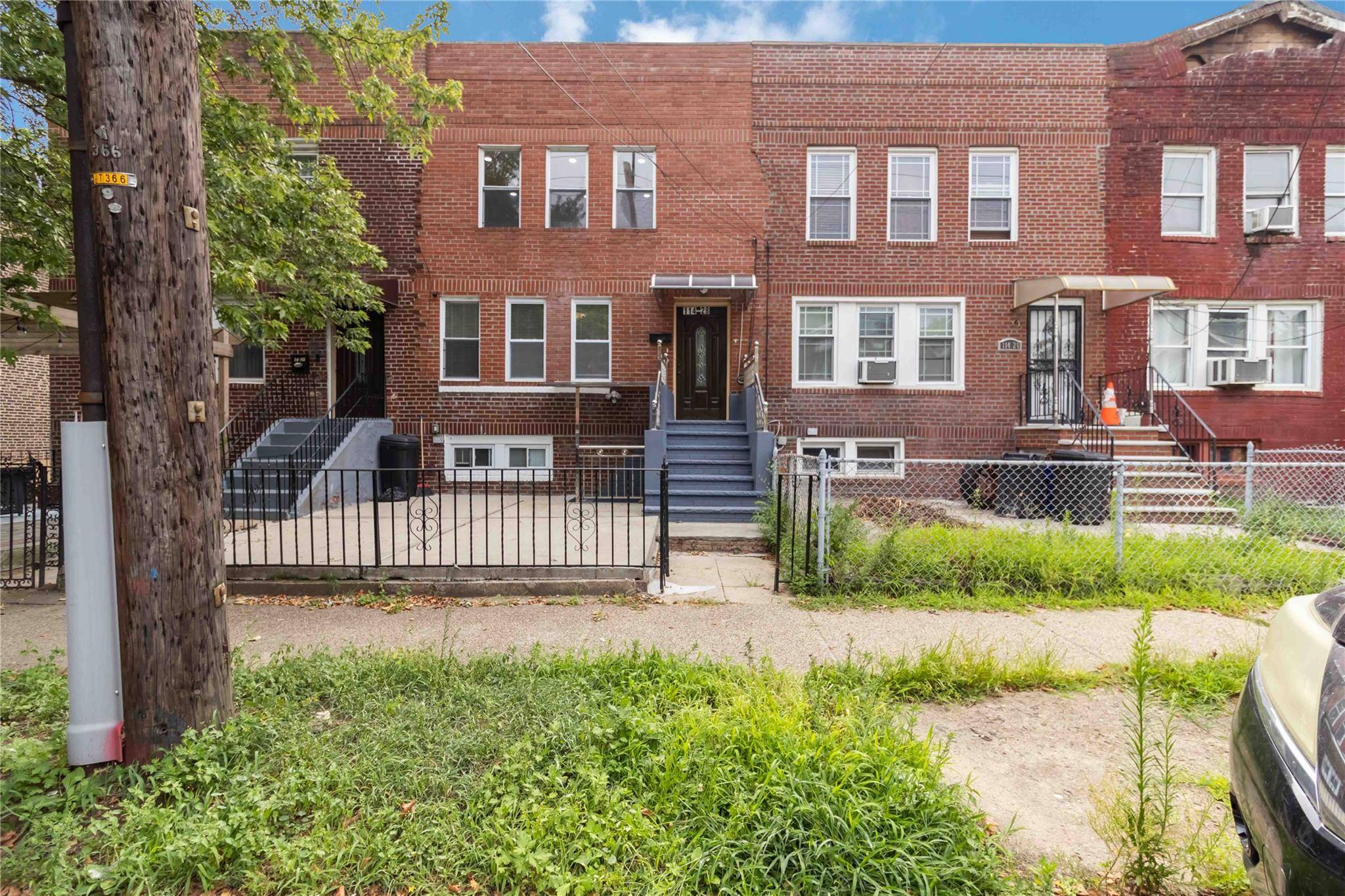 Welcome to this beautifully renovated brick move in ready attached 1 family home on a quiet block in prime Jamaica location.