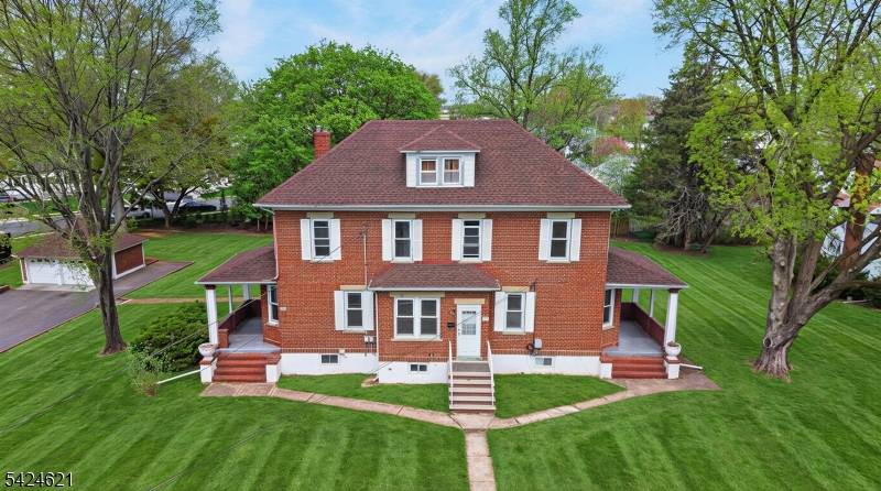 Rare find ! This all brick 2 family duplex is set on a scenic.