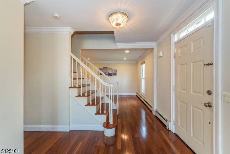 Step into the charm of Mountain Lakes living with this beautifully updated Colonial, offering stunning seasonal lake views and modern comforts.