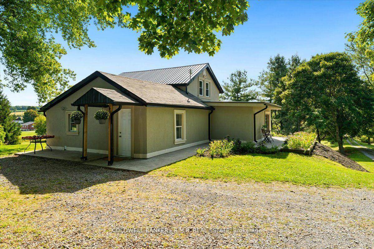 Step into this beautifully updated century home, tucked away on a gorgeous 7.