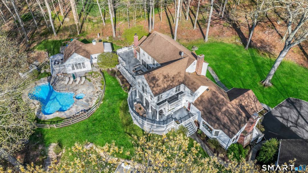 Welcome to 1541 Oenoke Ridge, a spectacular country retreat with unparalleled privacy and natural beauty.