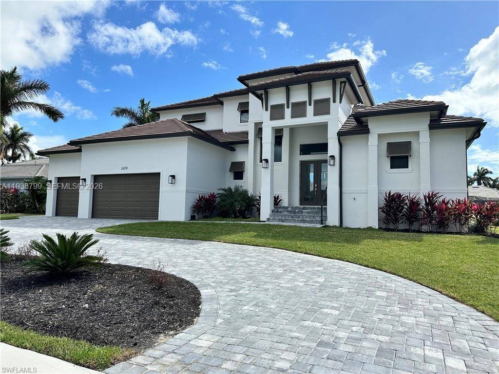 Welcome to an exceptional new construction waterfront residence in the heart of luxurious Marco Island.