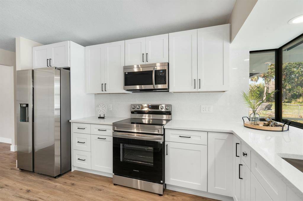 This beautifully remodeled pool home and offers the perfect blend of style and functionality.