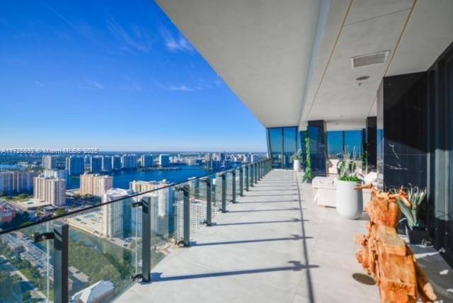 Enjoy unobstructed City, Intracoastal, and some ocean views from this high floor corner residence in Muse Sunny Isles Beach.