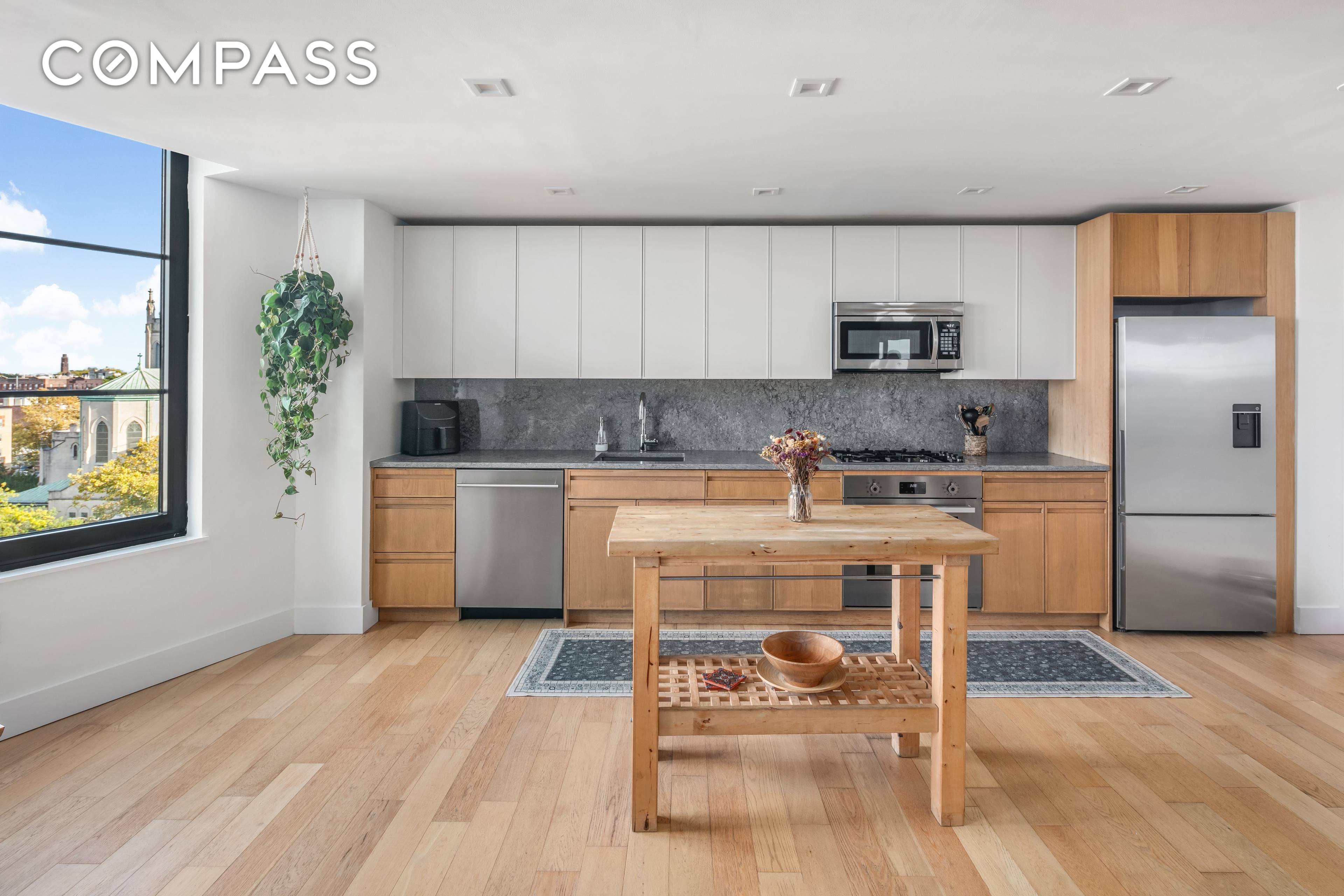 This stunning Penthouse, 811 at 264 Webster Avenue, offers seamless living with the added benefit of low monthly costs, thanks to a tax abatement in place until 2034.