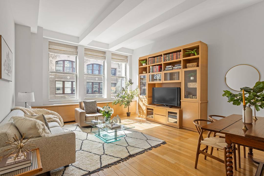 Welcome to 49 East 21st Street, 11B a sophisticated pre war two bedroom, two bath corner residence flooded with southern and western sunlight.