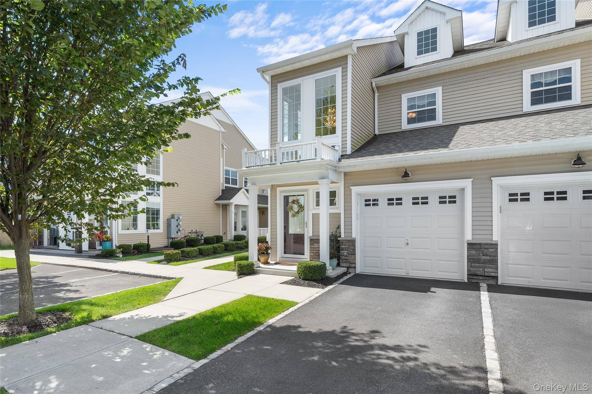 Welcome to The Vineyards at Blue Point, where luxury meets ease in a beautifully maintained 55 gated community.