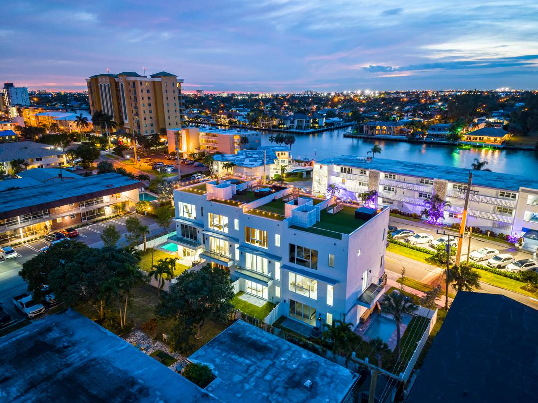 100 LEASED ! Discover the epitome of modern living in these stunning 4 unit townhomes, perfectly situated just one block from the renowned Pompano Beach.