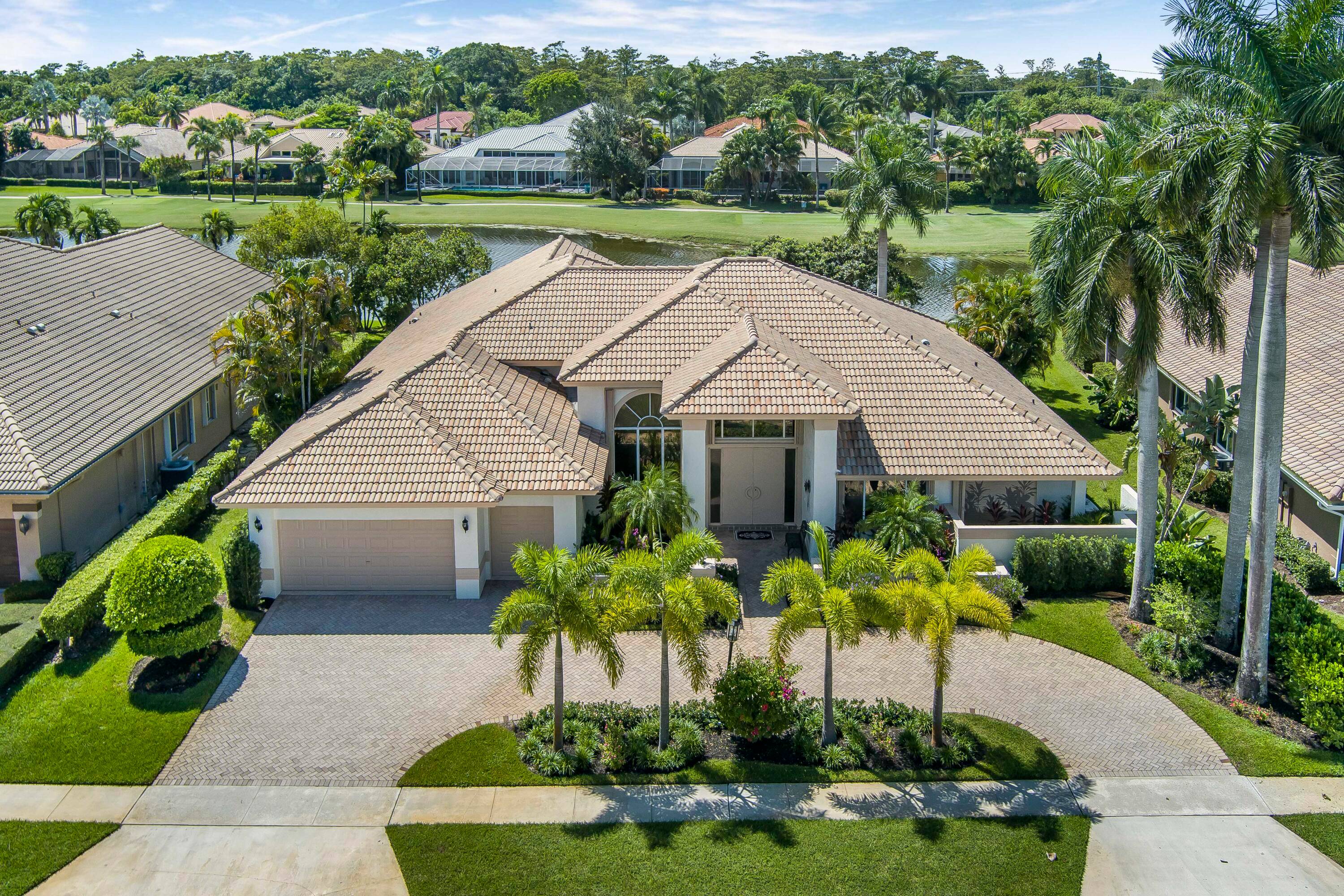 Enjoy sweeping lake and golf course views from this beautifully located 4 bedroom, 3.
