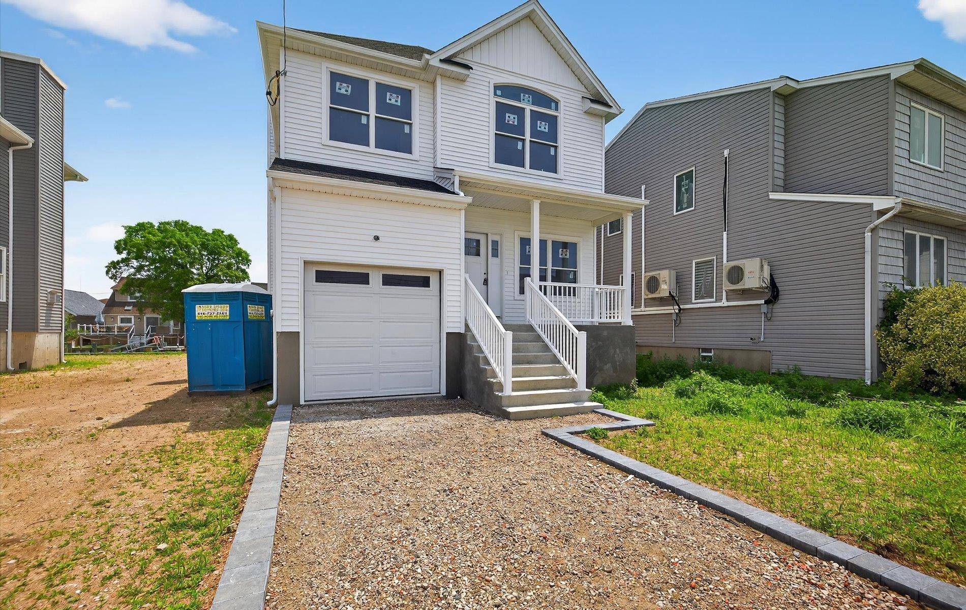 A newly constructed colonial waterfront residence is available in Baldwin Harbor.
