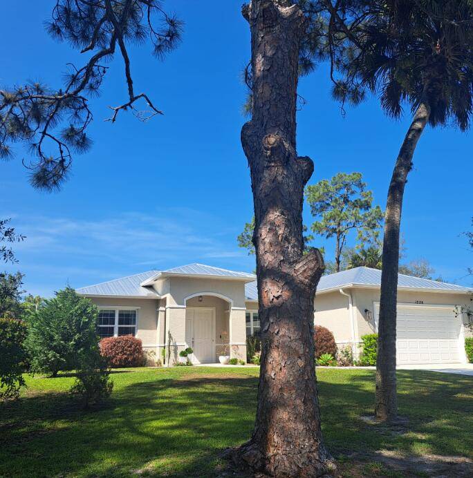 Welcome Home with solid CBS construction, 3 bedroom, 2 bathroom, 2 car garage, metal roof, sits on a spacious.