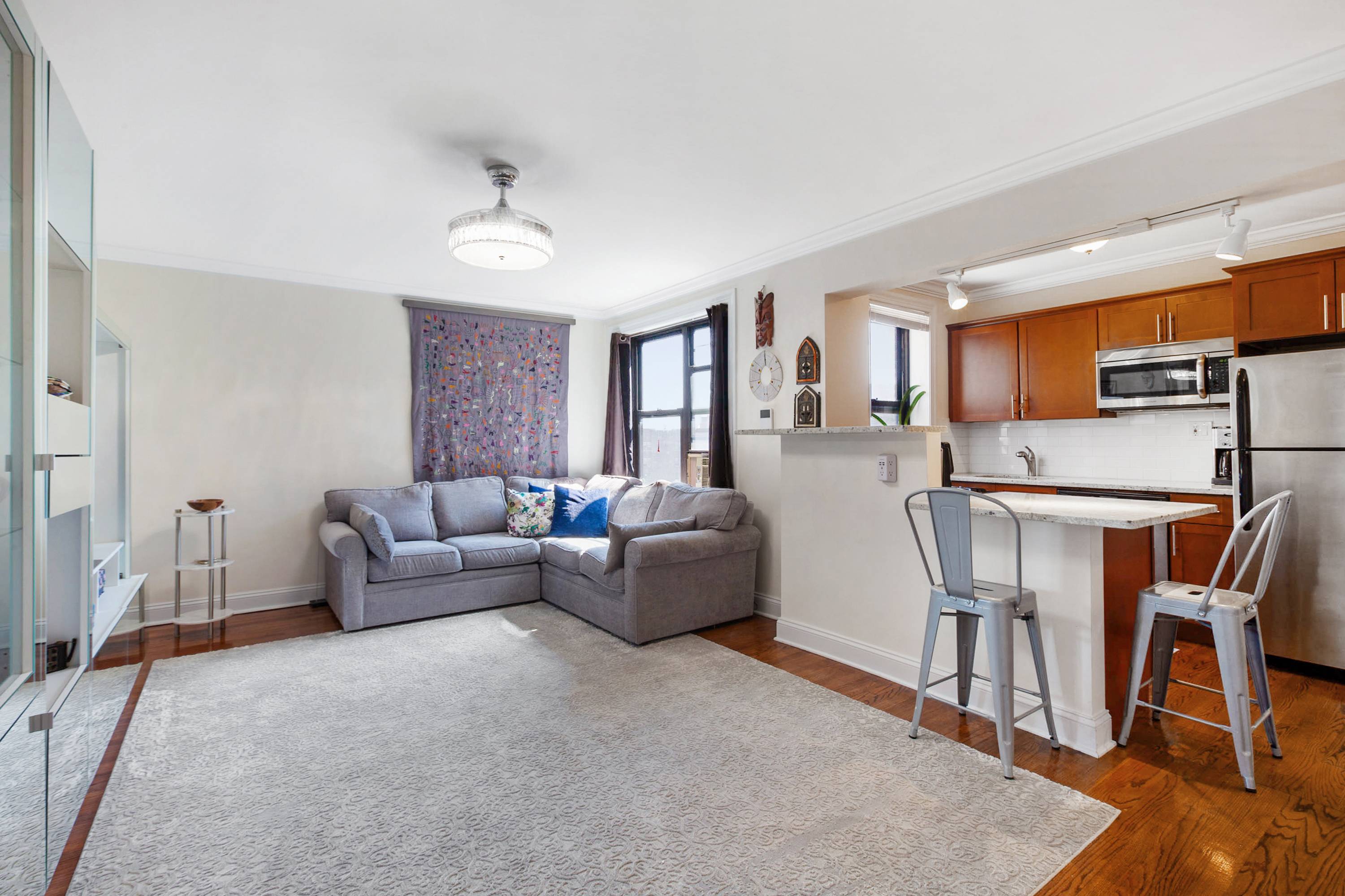 Cheerful Eastern light brightens your open concept, higher floor apartment home.