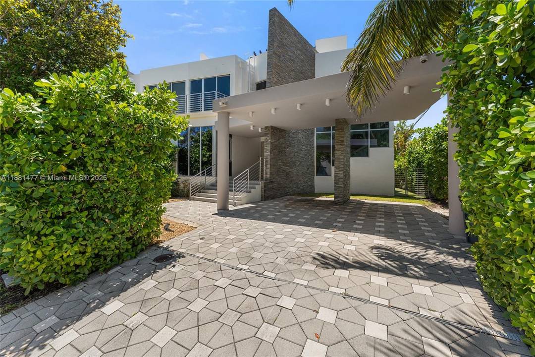 Welcome to The Village Green House, a modern 4 bedroom, 3 bath residence in one of the most coveted locations of Key Biscayne.