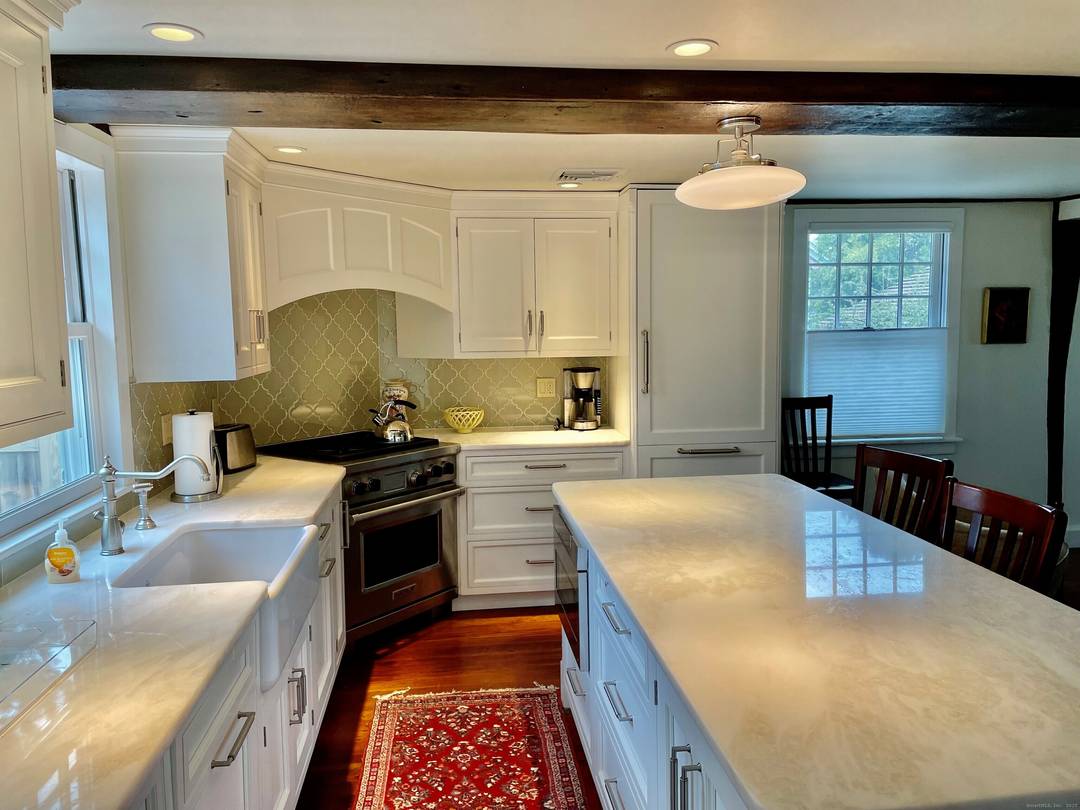 Beautifully renovated antique home with exposed beams, wide board floors and modern amenities.