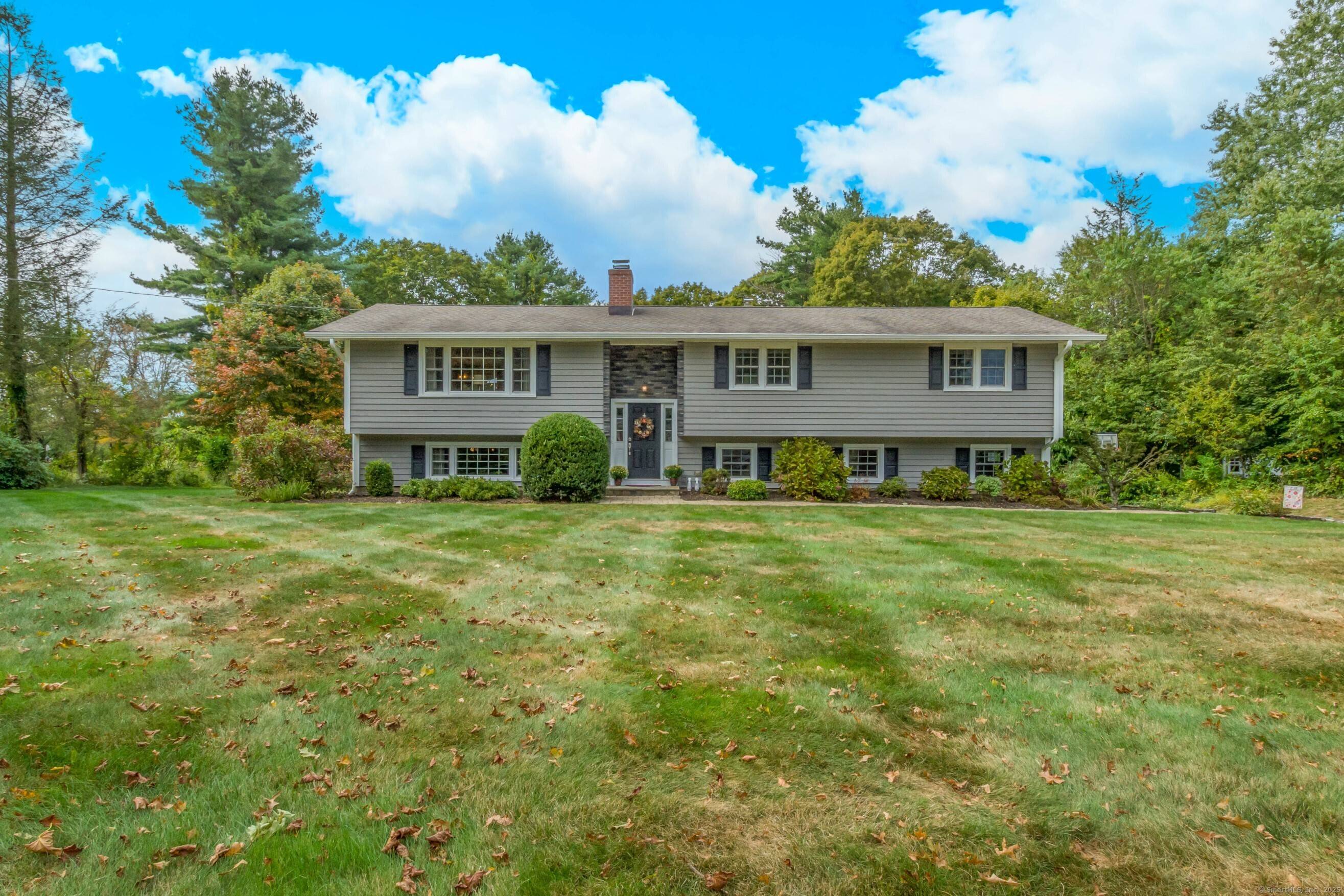 Welcome to this beautifully updated and expansive 5 bedroom, 3 bathroom Raised Ranch, perfectly situated on a flat, professionally landscaped 1 acre lot.