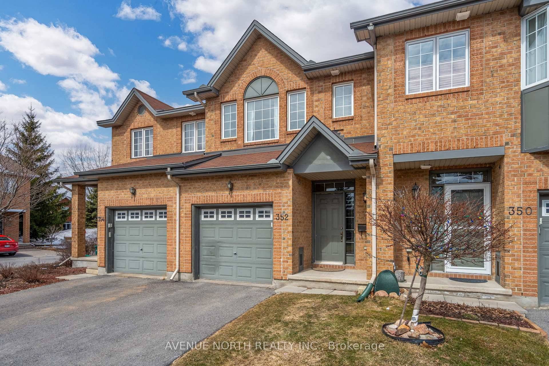 Step into this stunning brick townhome, where comfort meets elegance.
