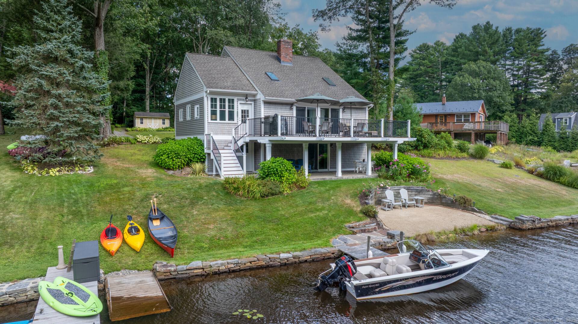 This charming, year round lake front home located at 115 Crooked Trail Ext in Woodstock, CT was built in 1986 and offers a cozy and inviting atmosphere.