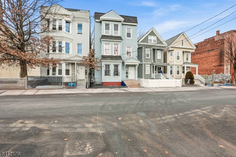 Welcome to 51 N 14th St, a beautifully renovated 3 family home offering strong income potential and modern updates in East Orange.