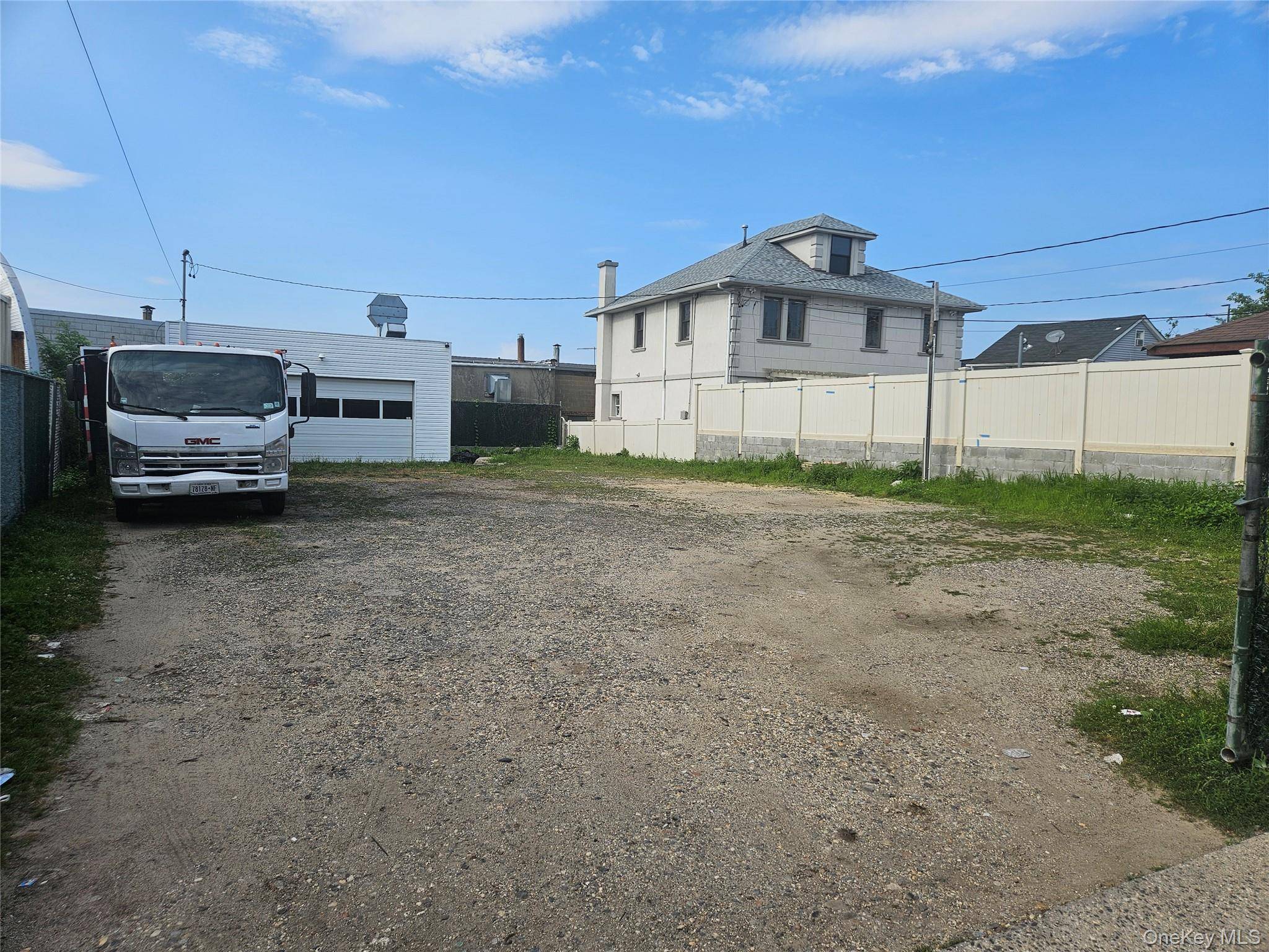 commercial vacant lot plus a 2 car garage good for Parking commercial vehicles or whatever use deemed fit