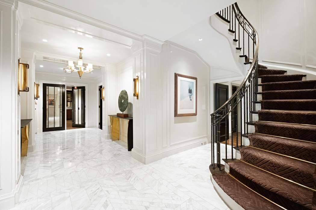 Ideally located on East 71st Street and situated in one of Park Avenue s most prestigious and sought after pre war cooperatives, this triple mint high floor duplex residence is ...