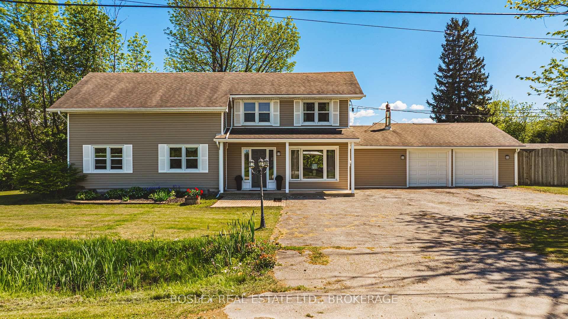 Welcome to 5272 Greenlane Drive, offering the tranquility of country living with exceptional convenience.
